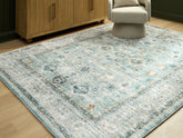 Leasing Furniture - Ashley Furniture - Ladstoney Rug - 7'6" x 9'6" Area Rug / Teal/Beige/Ochre - R407501