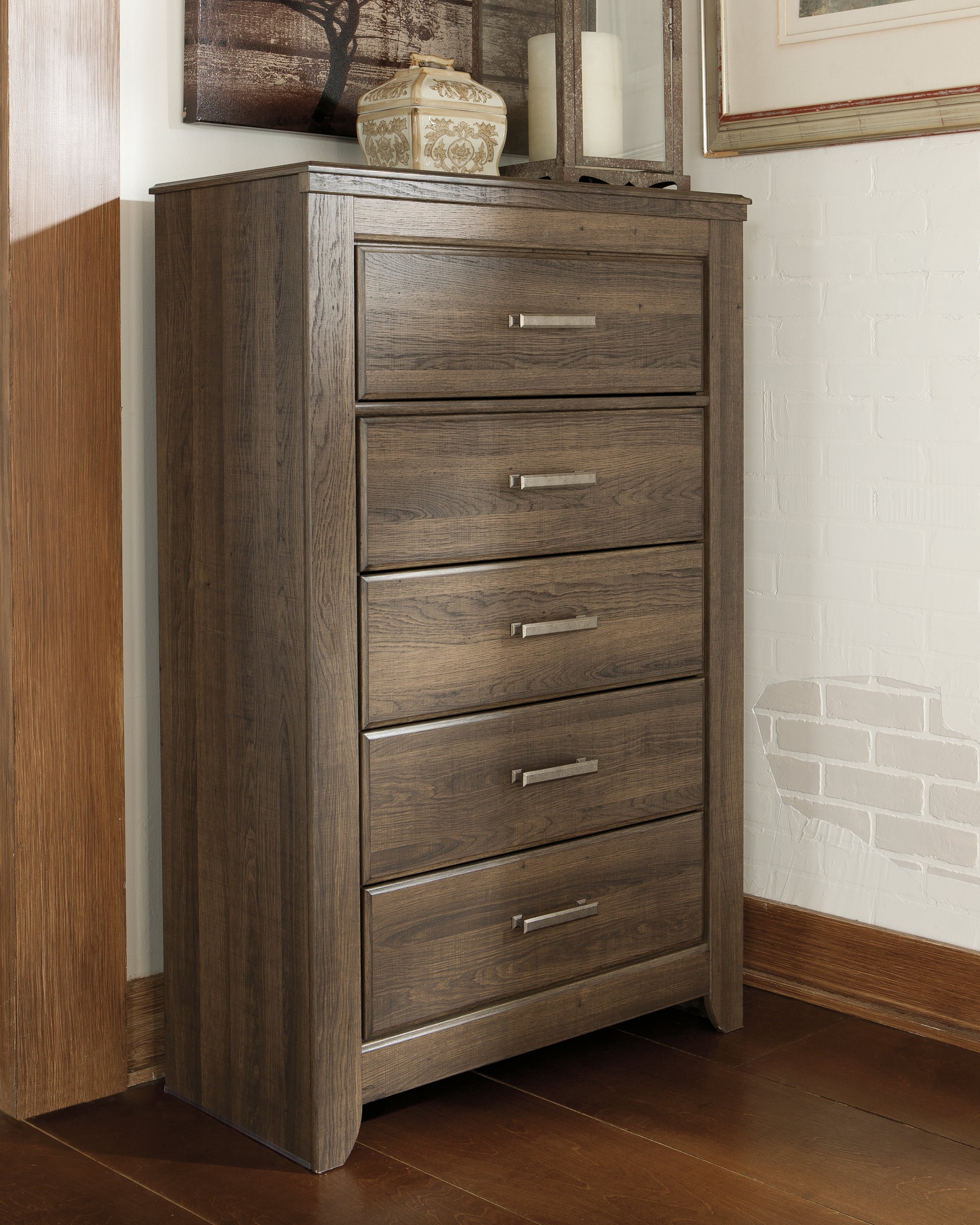 Leasing Furniture - Ashley Furniture - Juararo Bedroom - Five Drawer Chest / Dark Brown - B251-46
